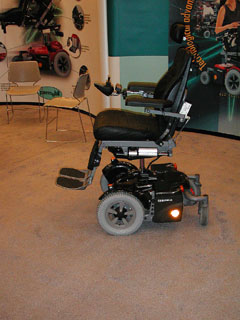 Powered wheelchair with lateral reflector