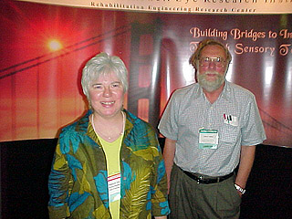 Debby Gilden and ??? in front of Smith-Kettlewell booth