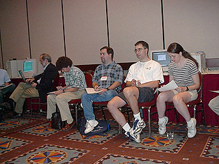 Filling out forms at  the SIG-11 Business Meeting