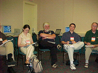 Denis Anson folds his arms at SIG-11 meeting