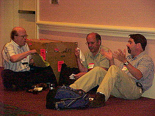 Al Cook, Jerry Weisman, and Kevin Caves find a comfy place for lunch and conversation