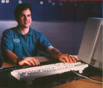 As he works on screen readers that help the visually impaired, software developer Andres Gonzalez, who is blind, uses a Braille keyboard to double-check his typing. His employer, Henter-Joyce, joins IBM and others in preparing Java-based products to open computing to the disabled.